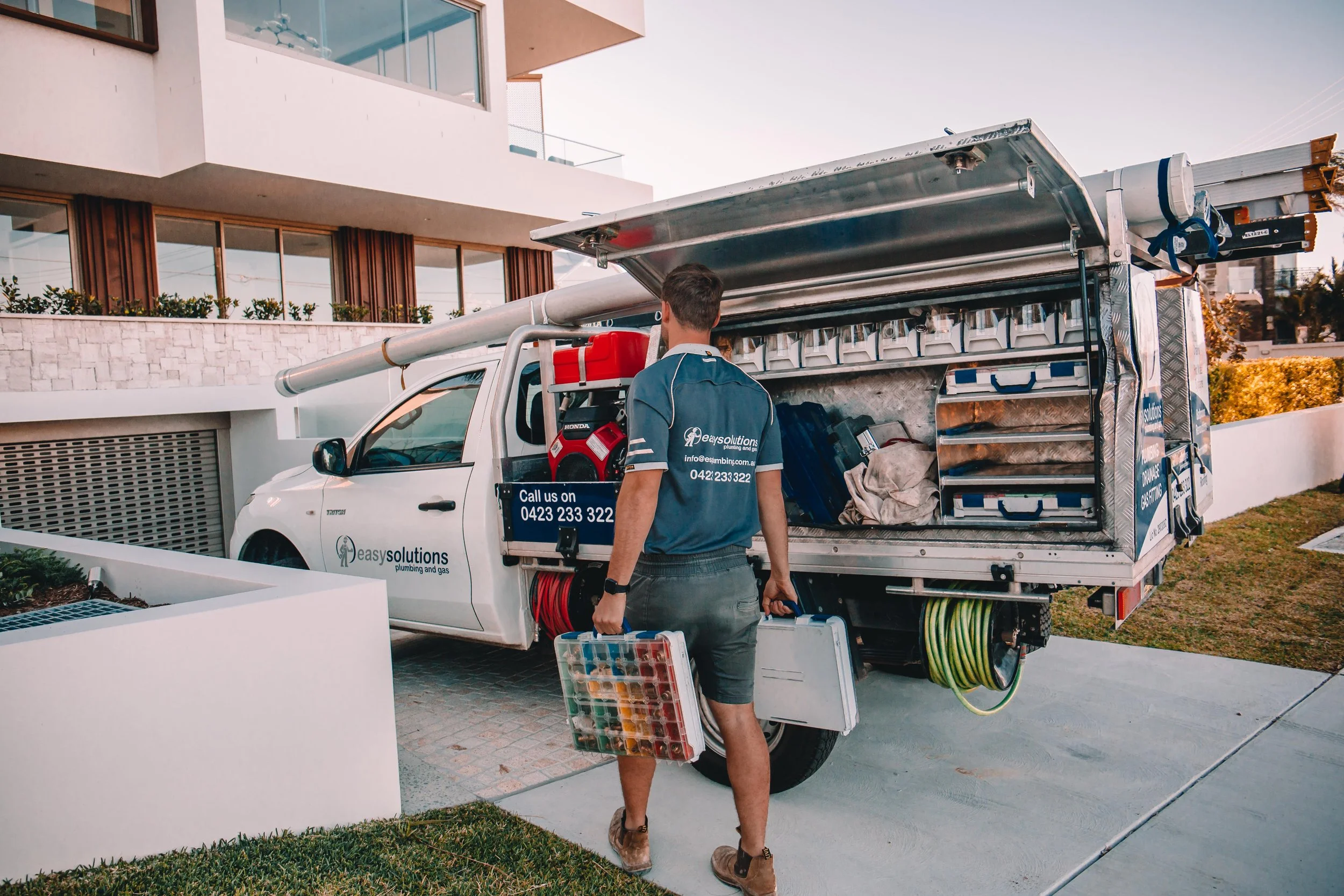 Easy Solutions plumber organising tools at branded service truck